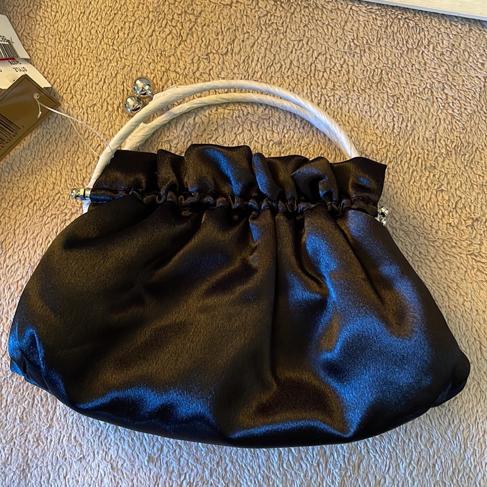 NWT Black satin like evening purse with Silver handle.